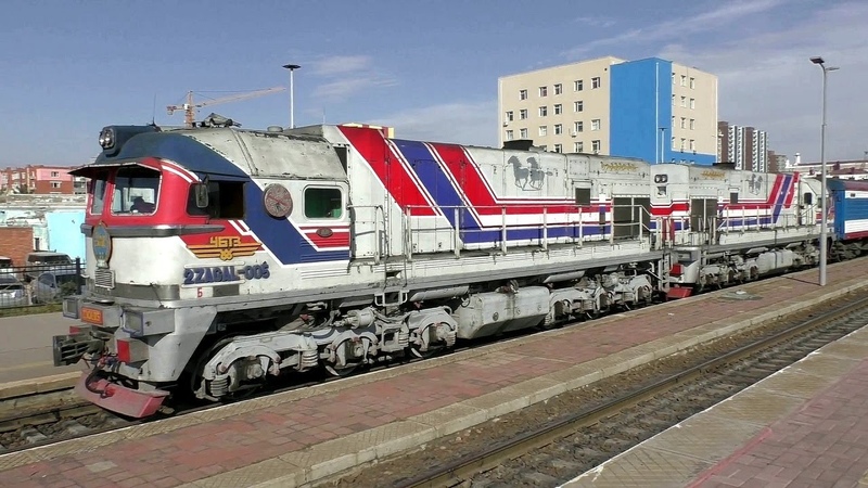 Long passenger trains at the Ulaanbaatar Station. Diesel locomotives. Railway in