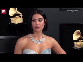 Silver siren! Dua Lipa flaunts curves in shiny gown at Grammys